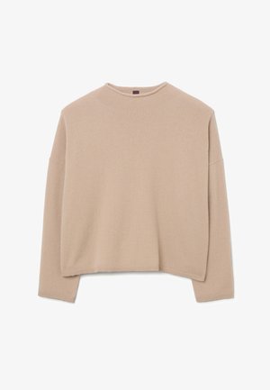 Beige oversized sweater made from soft knit material. Features a rounded neckline and dropped shoulders with ribbed cuffs and hem.