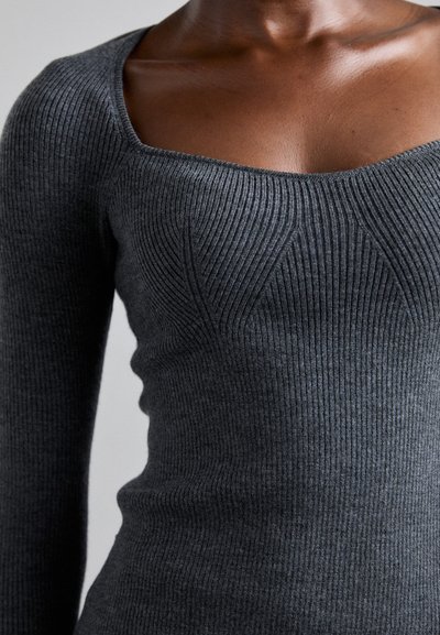 Gray ribbed knit top with a square neckline, long sleeves, and subtle textured detailing on the front. Soft material, fitted design.