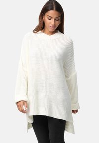 Leichter, cremiger weißer Strickpullover mit ribbeltem Halsausschnitt, langen Ärmeln und einem hohen-low Saum. Texturiertes offenes Webmuster.