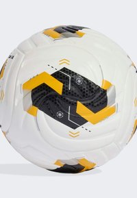 Soccer ball featuring a white surface with black and yellow geometric patterns, textured accents, and a traditional spherical shape.
