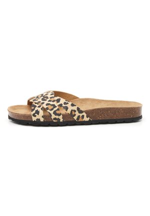 Sandale à semelle en liège avec des brides croisées à imprimé léopard en beige et noir. Design plat, bout ouvert et semelle texturée.