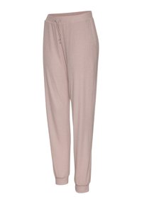 Light pink joggers made of soft fabric, featuring an elastic waistband with a drawstring, side pockets, and tapered cuffs at the ankles.