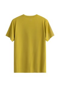 T-shirt gialla a maniche corte in morbido cotone. Collo rotondo, cuciture minime e un piccolo logo ricamato sul retro. Vestibilità casual.