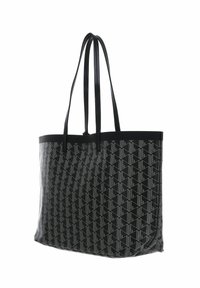 Sac fourre-tout noir avec un motif géométrique, présentant une texture lisse, deux longues poignées et une forme rectangulaire structurée.