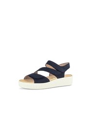 Sandalias de ante azul marino con diseño de tiras cruzadas, punta abierta y suela de goma blanca texturizada. Cuenta con una plantilla acolchada para mayor comodidad.
