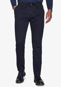Marineblaue Chinos mit einem Kordelzugbund, schlanker Passform und seitlichen Taschen, aus glattem Stoff mit einem klaren Design.
