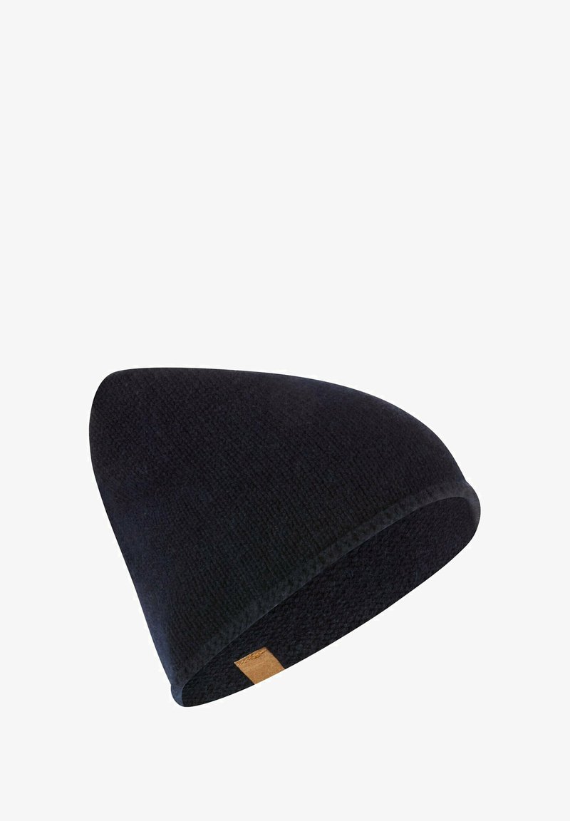 Zwarte gebreide beanie met een zachte textuur, puntige top en een klein leren labelaccent. Ontworpen voor warmte en comfort.