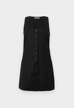 Vestido preto de linho com decote quadrado, forrado com uma fila central de seis botões e dois bolsos laterais, apresentando uma silhueta em A.