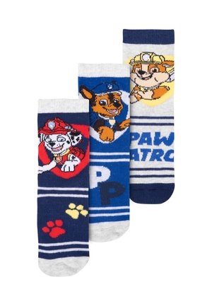 Tre paia di calzini con personaggi di "Paw Patrol". I colori includono blu, grigio, rosso e bianco, con motivi a righe e design stampati.