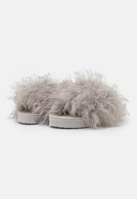 Faux fur sandals in light gray with fluffy texture, white platform sole, and open back design. Features thick, soft, hairy upper.