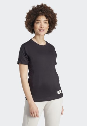 Black short-sleeve t-shirt made of smooth fabric, featuring a rounded neckline and an adidas logo at the hem on a white tag.