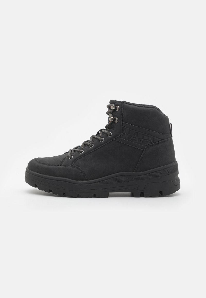 Black mid-ankle boots made of suede. Features metal eyelets, laces, and a textured rubber sole with a reinforced heel.