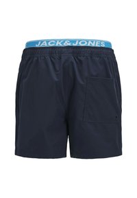 Marine zwemshorts met een elastische tailleband en het "JACK & JONES" logo in het blauw. Inclusief een zijzak aan de linkerkant. Glad van structuur.