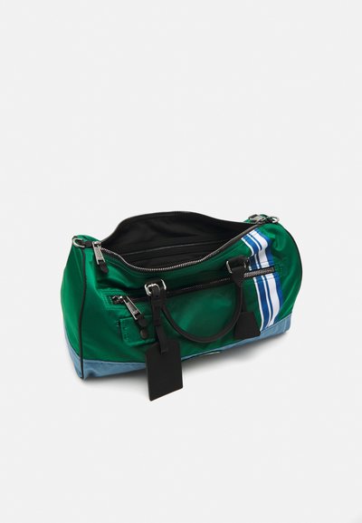 Green synthetic bag with black interior, features zip closure, side pockets, and blue bottom. Includes tag and three white stripes design.