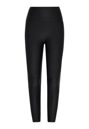 Leggings noires en matériau lisse et extensible, avec une taille haute et sans coutures visibles, présentant une coupe ajustée et fuselée.
