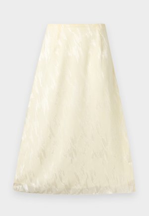 Κρεμ φούστα σε γραμμή Α με διακριτό υφασμάτινο μοτίβο και ψηλή μέση, παρουσιάζεται πάνω σε ουδέτερο φόντο.