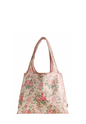 Sac fourre-tout en tissu rose clair avec motifs floraux et cœurs, larges bretelles et une petite étiquette sur le côté.