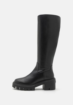 Knee-high black leather boots with a smooth texture, chunky platform sole, and a squared toe design. Minimalistic style with no visible accents.