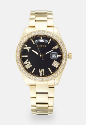 Reloj de oro con esfera negra, números romanos y pantalla de fecha, rodeado por un bisel con cristales, pulsera de acero inoxidable.