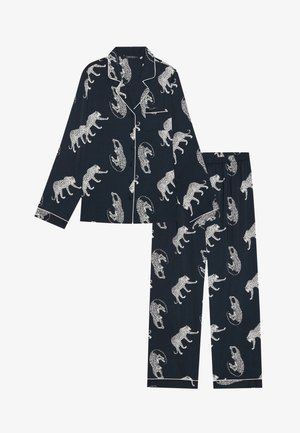 Navy pajama set featuring white leopard and crocodile patterns. Button-up top with collar and pocket, paired with elastic waist pants.