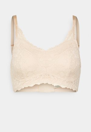 Čipkovaný bralette v telovej farbe s kvetinovými vzormi, z mäkkej tkaniny, nastaviteľné ramienka a vlnitý okraj. Pohodlný a bezšvový dizajn.