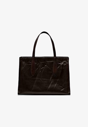 Brown leather tote bag with two elongated handles. Smooth texture, rectangular shape, slightly crinkled surface. No visible hardware or accents.