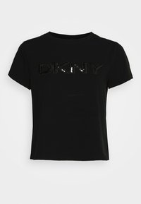 T-shirt in cotone nero con maniche corte e colletto girocollo. Presenta un logo "DKNY" in paillettes nere lucide sul petto.
