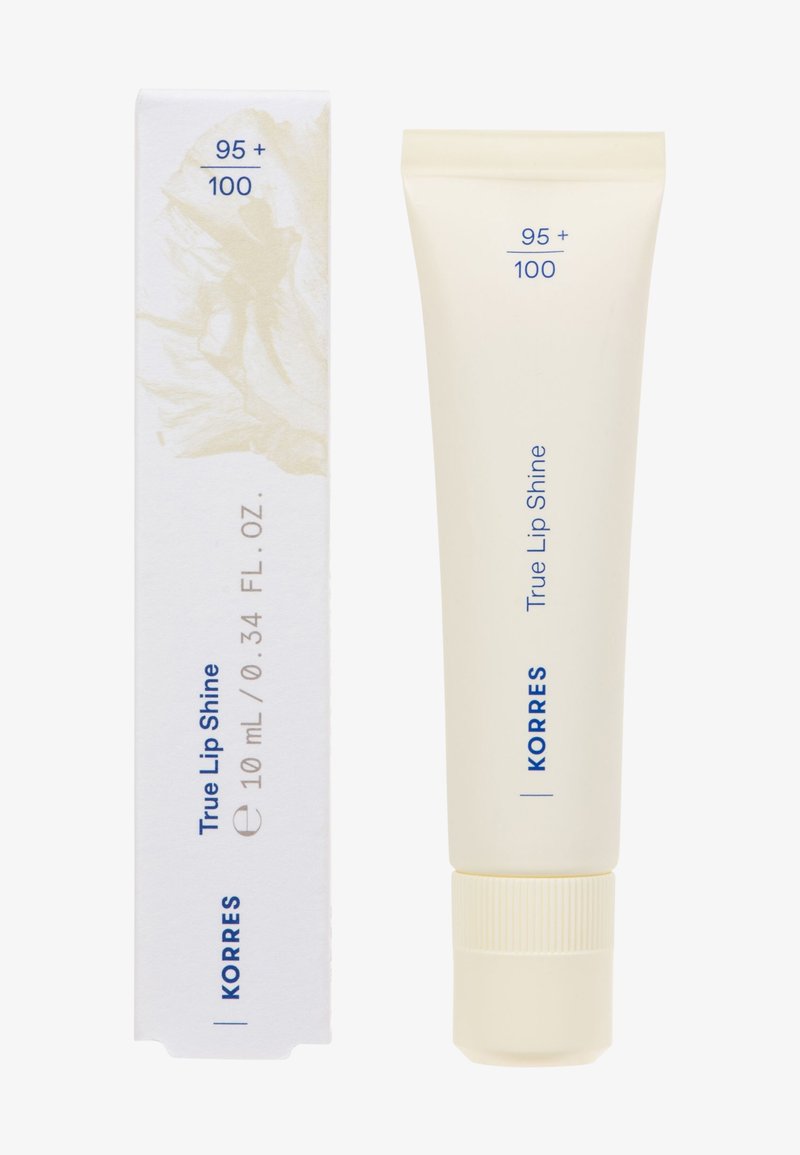 Korres True Lip Shine, tubetto da 10 mL, bianco opaco morbido con testo blu, tappo rigato, in una scatola bianca con un sottile design floreale.