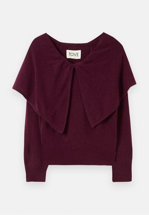Pull bordeaux avec un col large drapé, des poignets et unourlet côtelés. Présente un détail en nœud au niveau du col. Fabriqué en un matériau doux et texturé.