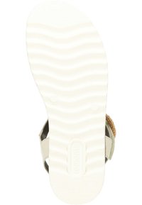 Witte rubberen zool met golvend profiel, beige banden en gevlochten accenten. Ontworpen voor comfort en duurzaamheid.