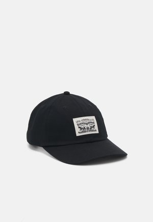 Black baseball cap made of cotton with a front patch displaying Levi Strauss & Co. logo. Features a curved brim and six-panel design.