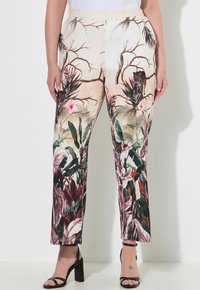Pantaloni in un tessuto beige chiaro con un motivo floreale tropicale colorato. Design a gamba dritta con una texture morbida.