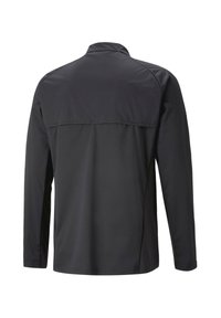 Giacca nera a maniche lunghe con colletto alto, texture liscia e design sportivo, dotata di uno spacco sul retro per la ventilazione.