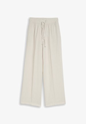 Pantalon beige à jambes larges avec fines rayures verticales, taille élastique et fermeture à cordon à l'avant.