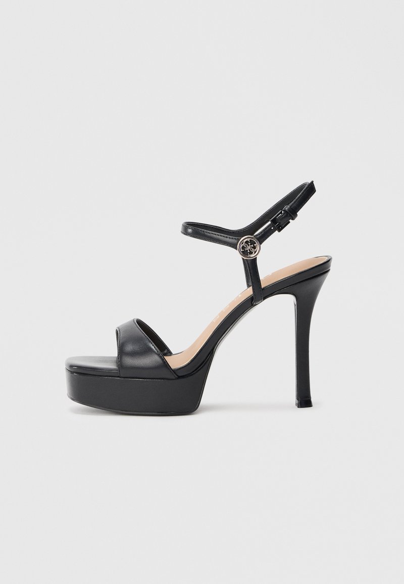 Sandali con plateau neri con tacco a spillo alto, caratterizzati da una tomaia in pelle liscia, design con punta aperta e cinturino alla caviglia regolabile con fibbia metallica.