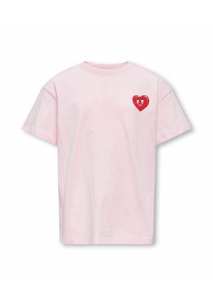 Maglietta rosa chiaro a maniche corte con una piccola grafica di un cuore rosso con occhi, posizionata sul petto in alto a sinistra.