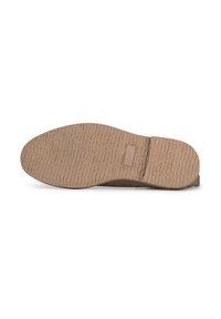 Suola piatta di scarpe con un materiale in gomma testurizzato di color beige chiaro. L'esterno presenta un motivo ondulato per garantire aderenza e un'area del tallone liscia.