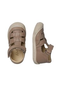 Bruna läderskor med en texturerad yta, med en vävd design på toppen, kardborreband och en vit gummisul med rundad tå.