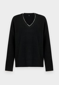 Black oversized sweater with a deep V-neck, ribbed texture, and long sleeves. Notable light-colored stitching around the neckline.