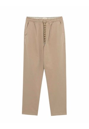 Pantaloni leggeri beige con una cintura regolabile a cordino, due tasche laterali e un design a gamba affusolata. Tessuto dalla texture liscia.