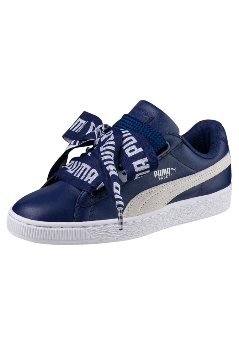 Navy blue leather sneaker with white rubber sole, features a textured midsole, and large printed laces. Logo on the side and top.