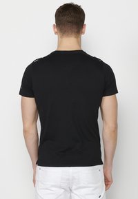 Koroshi Apdrukāts T-krekls - black
