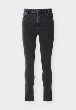 Svarte, høytlivde skinny jeans med lommer foran og bak, knapp- og glidelåslukking, vist på en flat overflate.