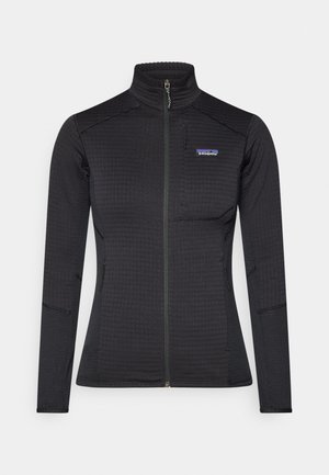 Black zip-up jacket made of textured fabric, featuring stand-up collar, long sleeves, and subtle logo on the chest.