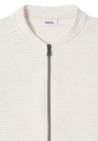 Světlý krémový zipový svetr s žebrovanou texturou, zaobleným límcem a kovovým zipem. Štítek uvnitř límce nese nápis "CECIL".