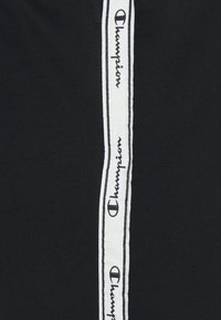 Champion Teplákové kalhoty - black