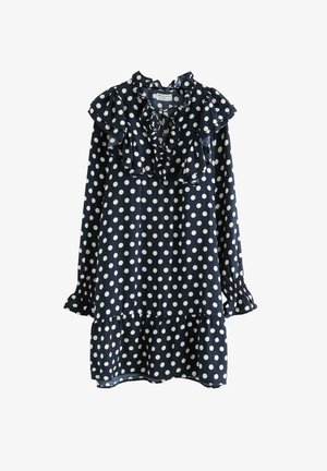 Abito blu navy con pois bianchi, con scollatura e maniche arricciate, orlo a strati e tessuto leggero e texturizzato.