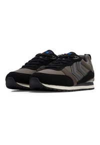 Black and gray athletic shoes with a suede and fabric upper, featuring textured accents and a rubber sole, designed for comfort and support.
