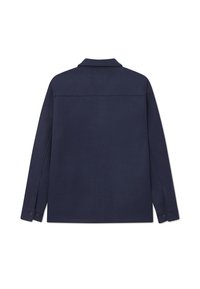 Navy blue shirt jacket made of textured fabric, featuring a collar, long sleeves, and buttoned cuffs. Back view shows clean lines and stitching.