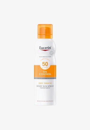 Eucerin Sonnensprayflasche mit weißem Körper, orangefarbenem Deckel und einem Etikett mit den Aufschriften "Öl Kontrolle" und SPF 50. 250 ml Kapazität.